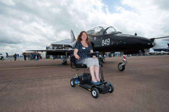 Karen Cox overcame her disabilities while learning to fly.