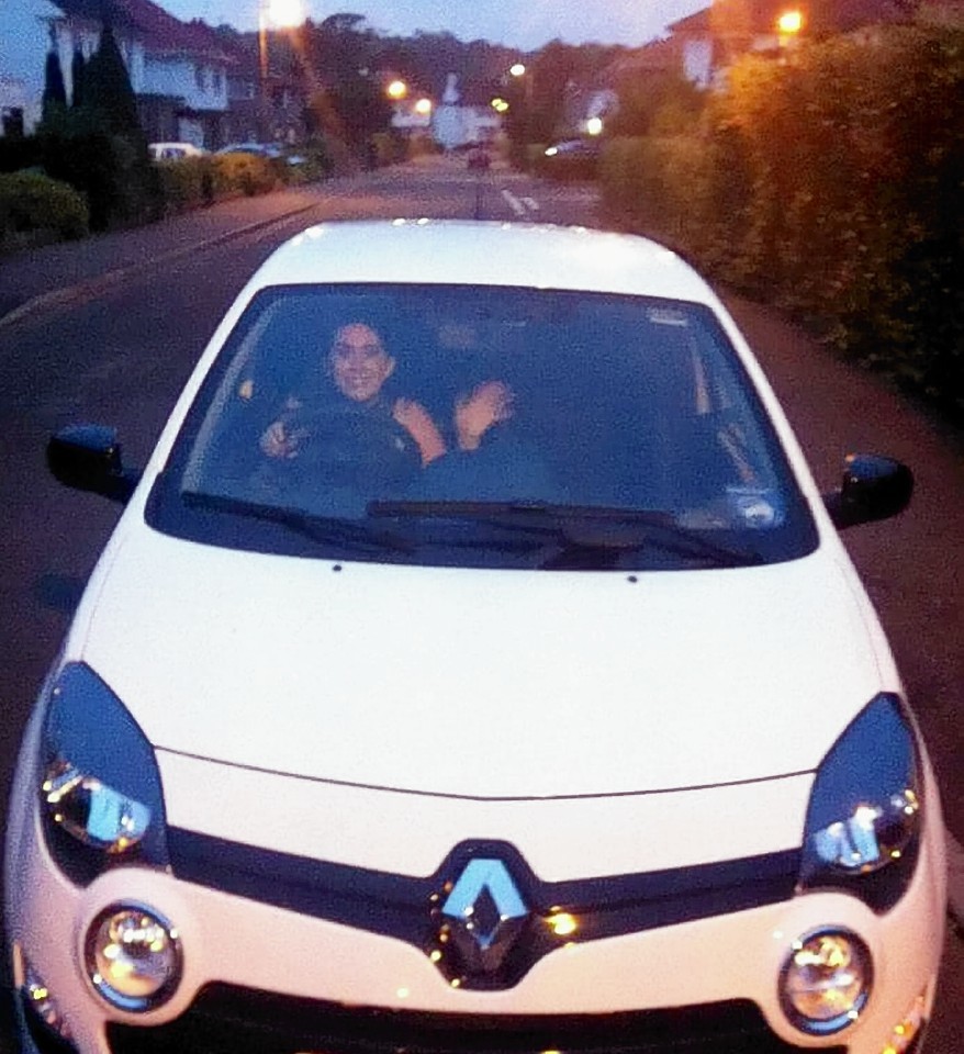 Lizzie Connell in her car before it burst into flames