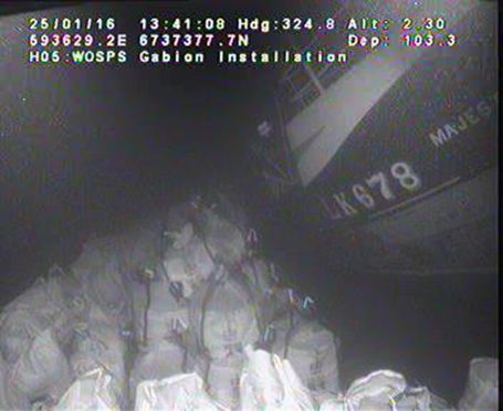 Underwater image showing sandbags against the wreck of Majestic