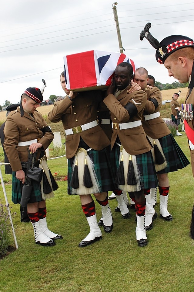 Soldiers at Mr Morrison's funeral carry the coffin