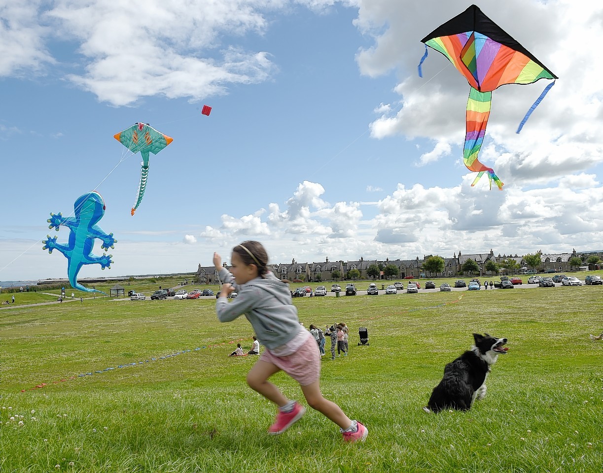 Six year old Freya Isaacs flying kites in Nairn