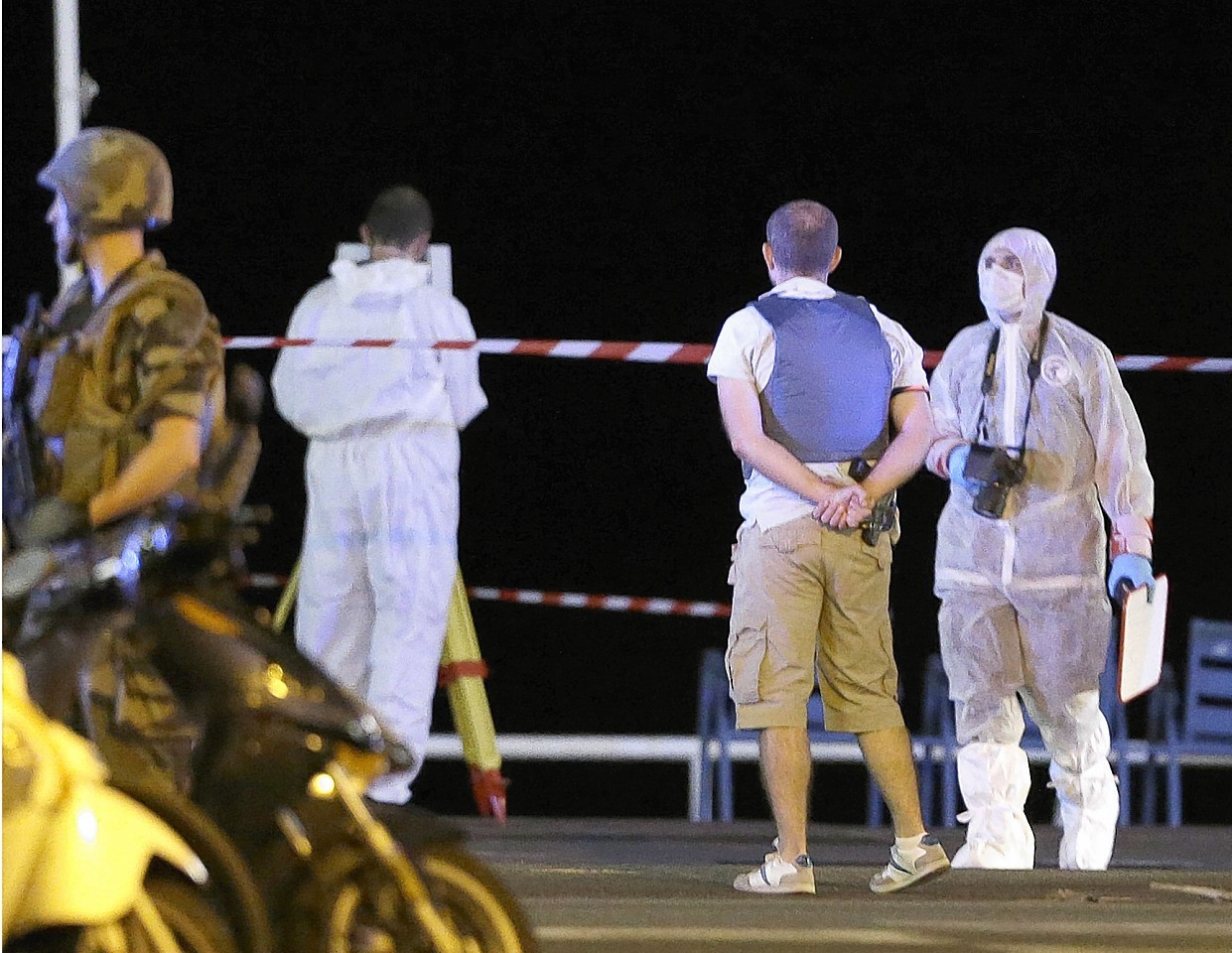 Forensic officers at the scene of an attack