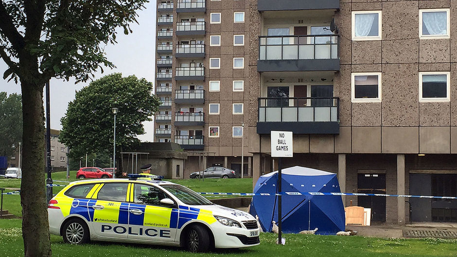 Police at the scene at Donside Court, Tillydrone, Aberdeen, where three people died following a disturbance