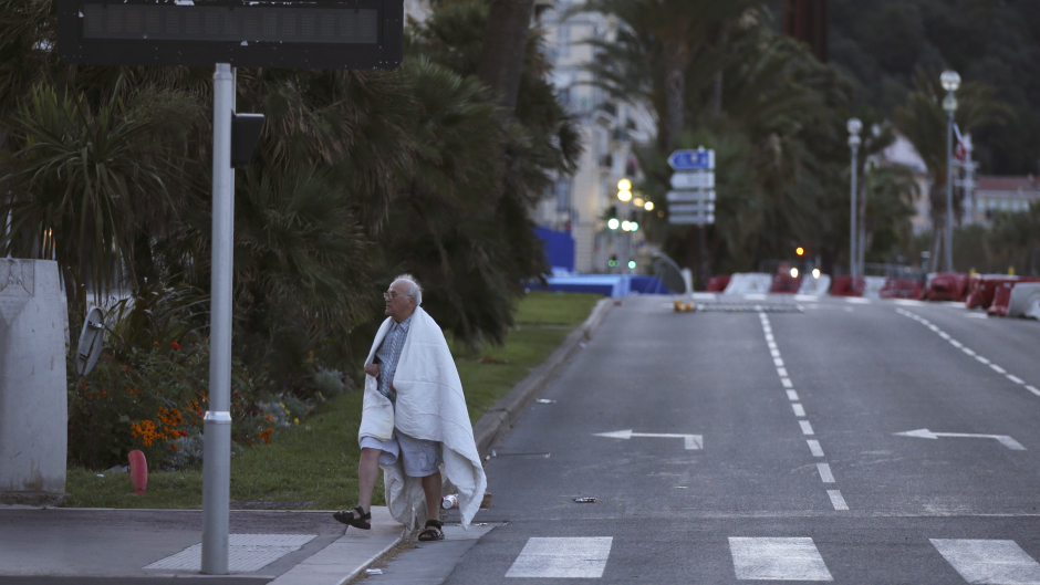 A man walks near the scene of the attack (AP)
