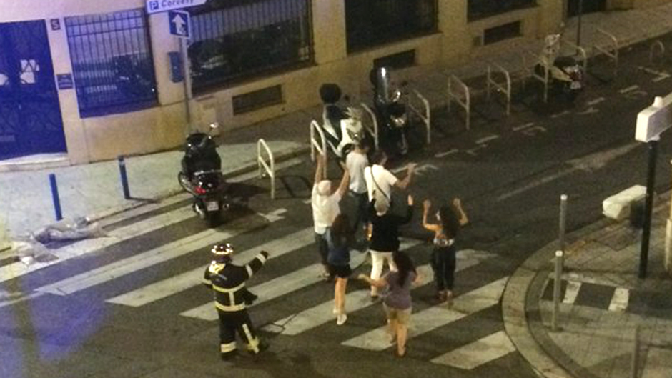 Police escorting people back to their hotels with their hands in the air in Nice (Tereza Cervenova/Twitter/PA)