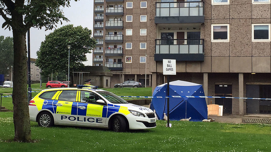 Police at the scene at Donside Court, Tillydrone, Aberdeen, where three people died following a disturbance