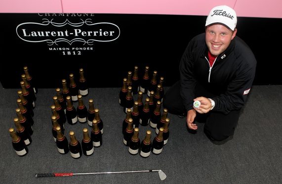 Andrew Johnston of England celebrates his hole in one