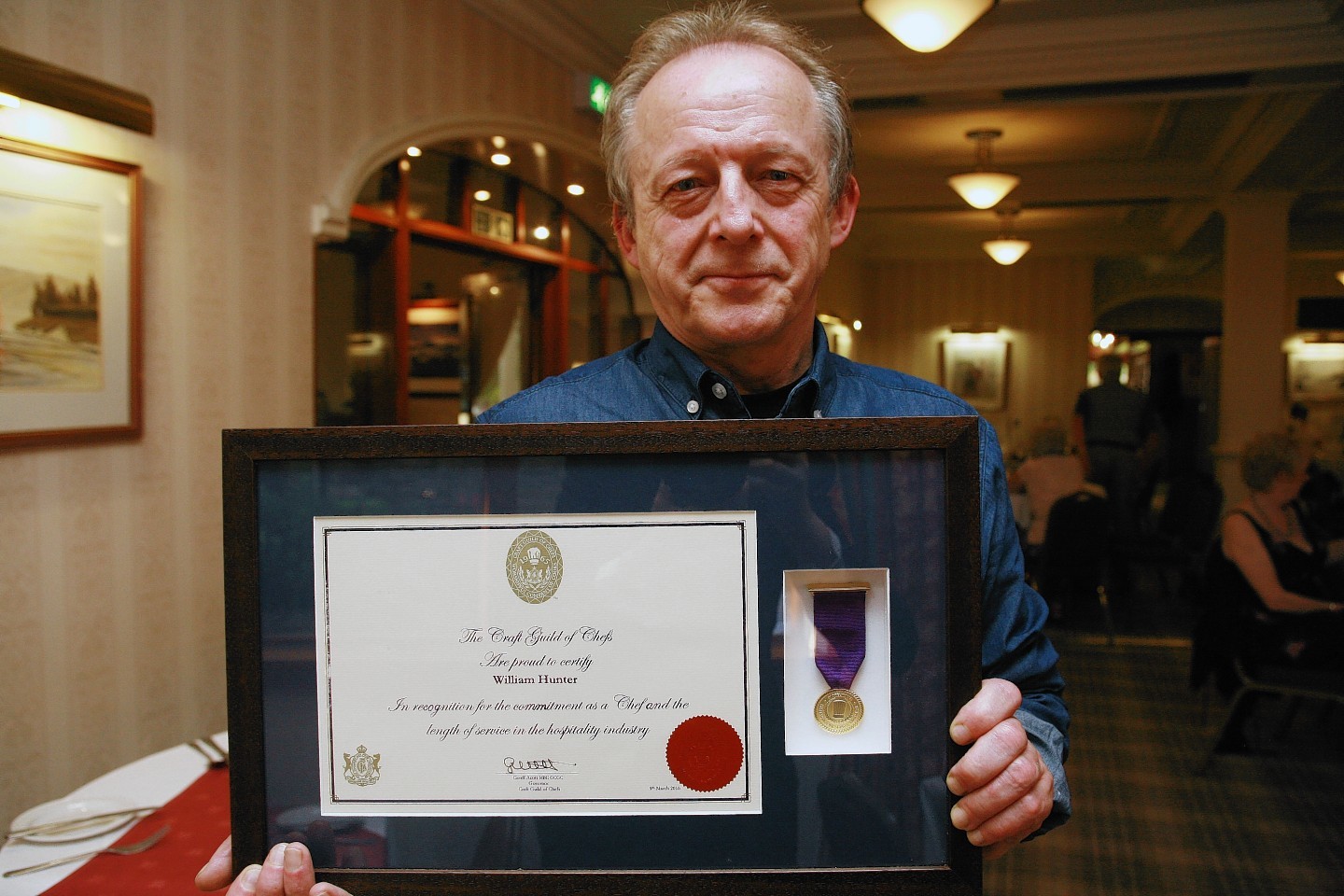 William Hunter with his Gold Medal and certificate