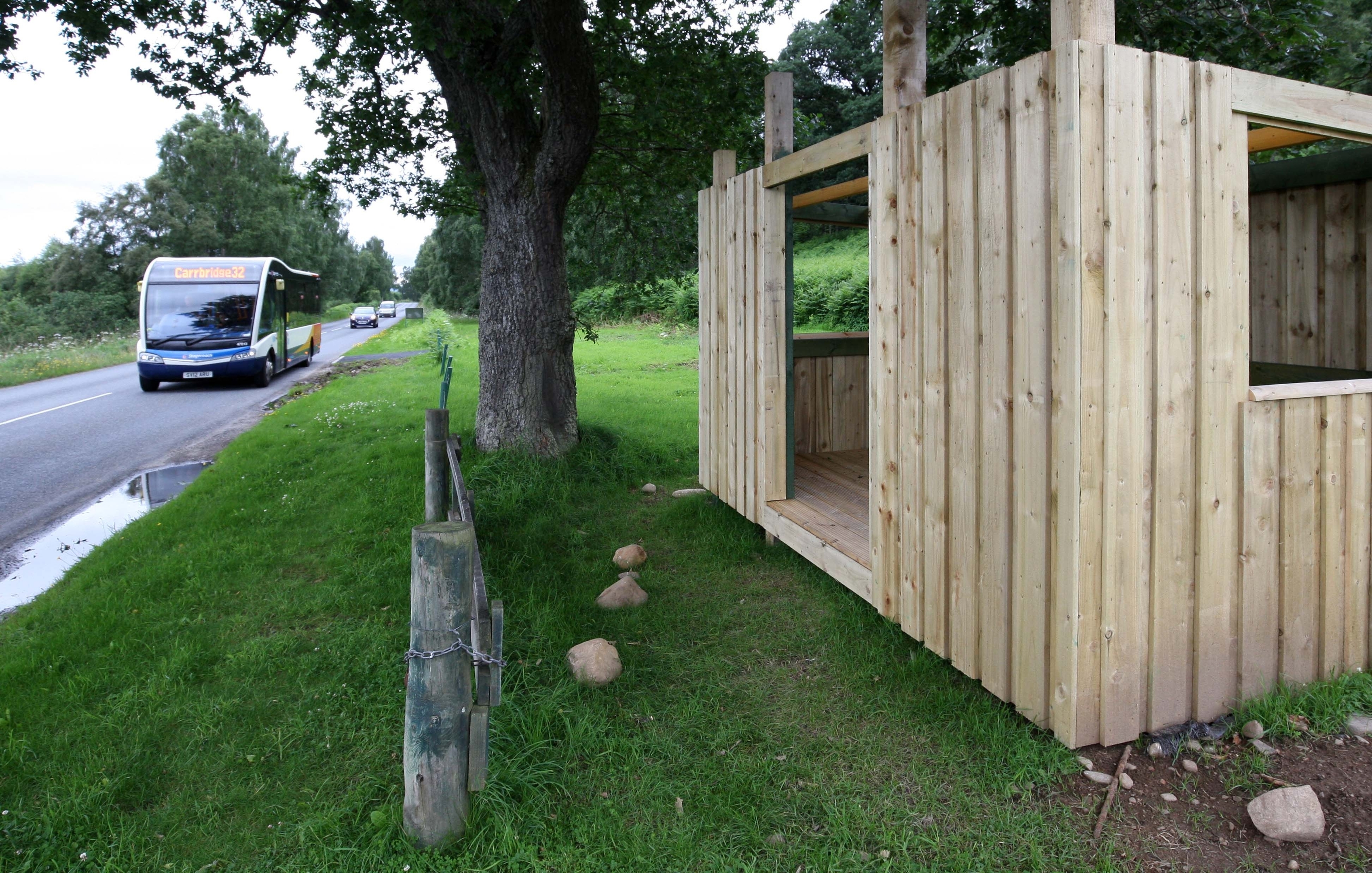 A new bus stop and bus shelter at the Highland Wildlife Park have been built around 30 yards apart, on either side of a fence. Picture: Andrew Smith
