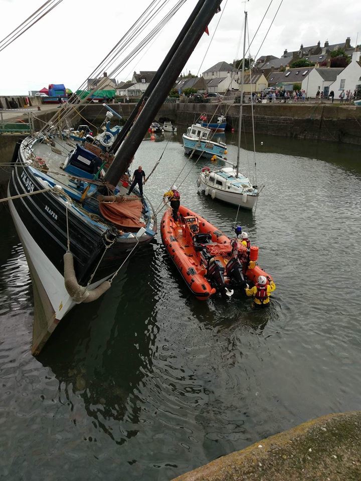 Coastguard with the Reaper in Johnshaven Harbour