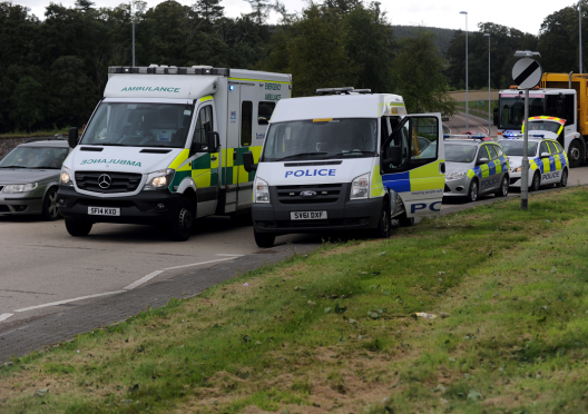 Police and ambulances attend incident at Fochabers roundabout on the A96. Picture by Gordon Lennox.