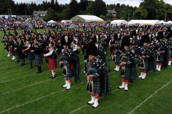 The massed bands gather for to pipe in the Lord Lieutenant. (Picture: Kenny Elrick).