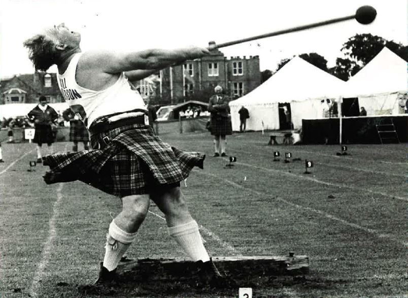 Bill Anderson of Aberdeen take the strain in the light hammer open event at Aboyne Games - August 1984