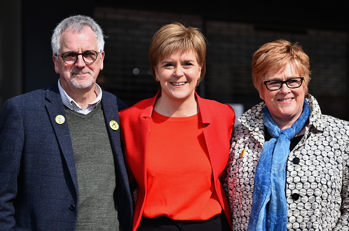 First Minister Nicola Sturgeon (C) stands with her mother Joan and father Robin