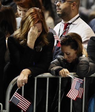 Supporters react to election results during Democratic presidential nominee Hillary Clinton's election night rally in the Jacob Javits Center glass enclosed lobby in New York, Tuesday, Nov. 8, 2016. (AP Photo/Frank Franklin II)