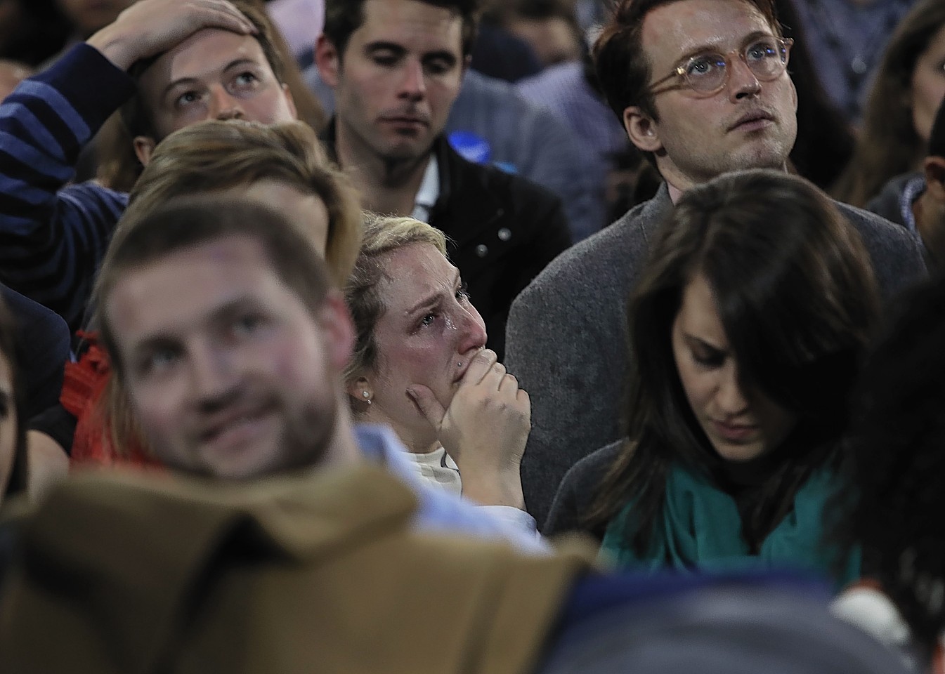 Supporters react to election results during Democratic presidential nominee Hillary Clinton's election night rally in the Jacob Javits Center glass enclosed lobby in New York, Tuesday, Nov. 8, 2016. (AP Photo/Frank Franklin II)
