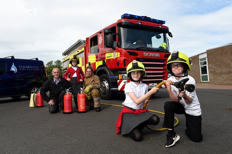 Clearwater Fire Services held a fire safety event at Balmedie Primary School with local firefighters.
Picture of (L-R) Lee Morgan (Clearwater Fire Services) P6 pupil Katy, firefighter Nicolle Beattie, P6 pupils Mirrin and Dylan