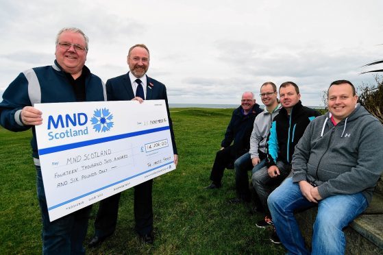 GEORGE HASTIE (L) AND MND SCOTLAND CEO CRAIG STILTON WITH A CHEQUE FOR £14,206, THE PROCEEDS OF A GOLF CHARITY DAY AT INVERALLOCHY ORGANISED BY THE HASTIE FAMILY.