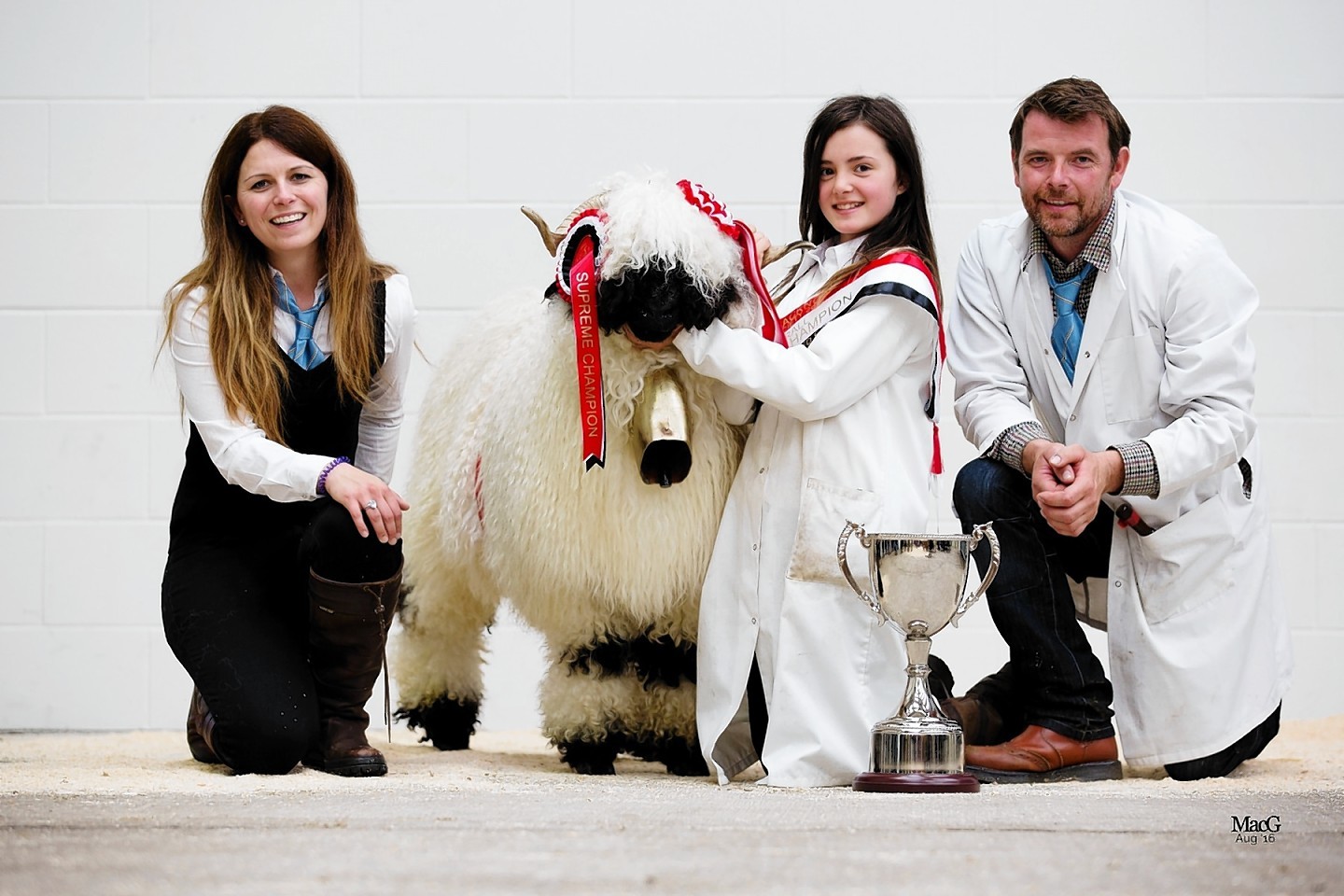 Jenni McAllister (left) and Raymond Irvine with their daughter Adele and champion sheep Highland Breeze