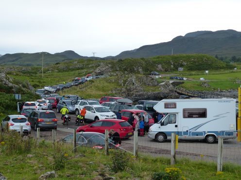 Cars and camper vans queue up for the ferry at Kilchoan on Saturday evening