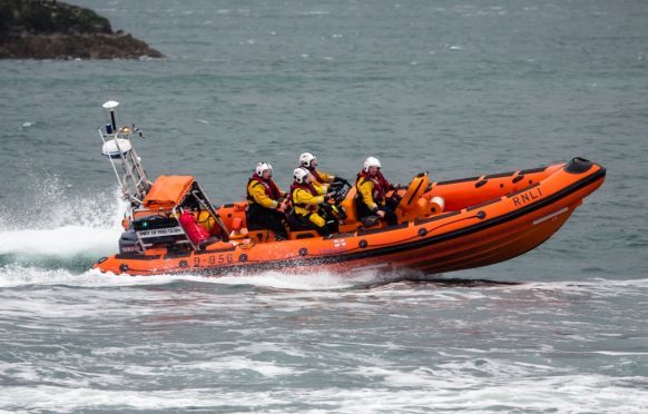 A lifeboat has been sent to assist with the rescue of the man.
