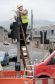 A Highland Council engineer repairs and replaces the damaged lights at the Huntly Street-Ness Bridge junction in Inverness.