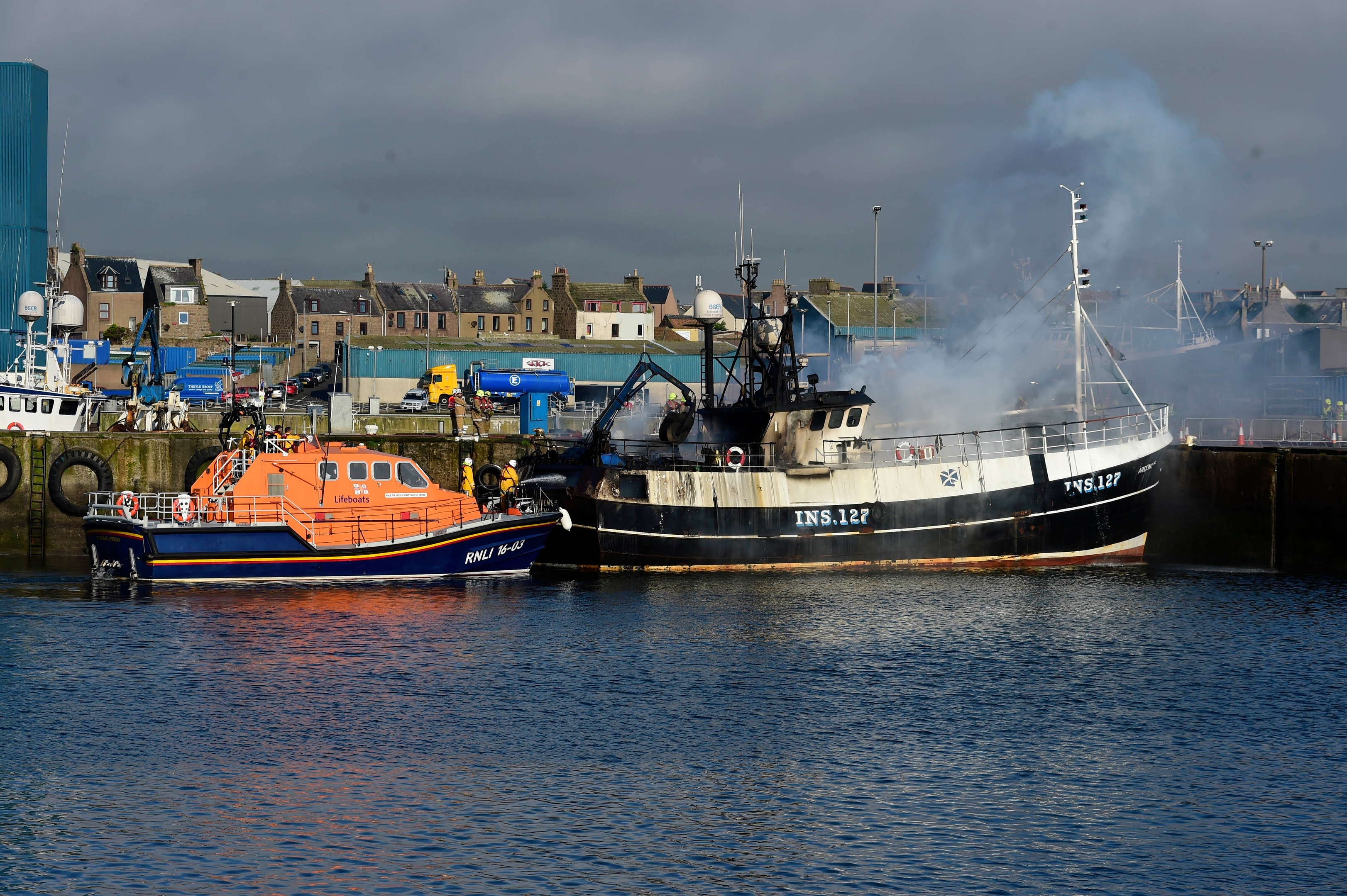 The boat on fire in Peterhead Harbour