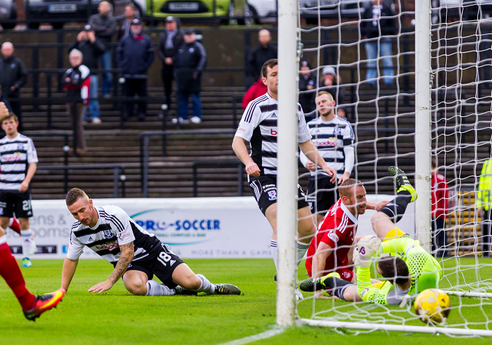 Ayr's Daryll Meggatt (18) scores and own goal putting Aberdeen into the lead (0-1)