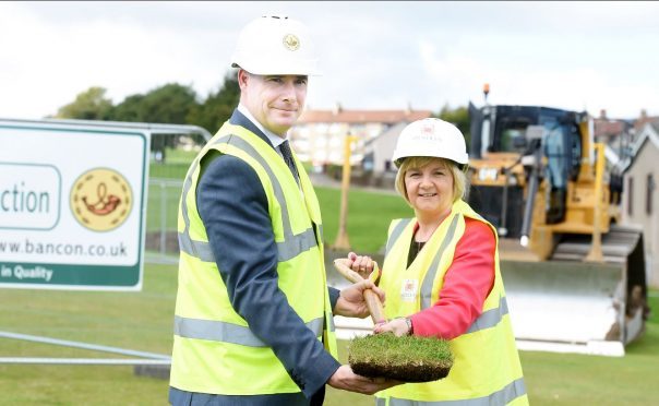 Sod cutting at manor walk, middlefield, Aberdeen, to build a housing development. In the picture are Gavin Currie, managing director, Bancon Constuction, left and Aberdeen City council leader, Jenny Laing. 
Picture by Jim Irvine
