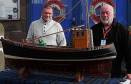 Alan Ritchie (left of picture) presenting Dave Ramsay with the hand – made working model of his great - grandfather’s boat the “Happy Return,” named after his return from Germany in 1918. The boat is now on permanent display in the Maggie Law Maritime Museum) Photo: Deryk McNeill