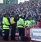 Fans are monitered by police during Aberdeen v Rangers clash in 2006