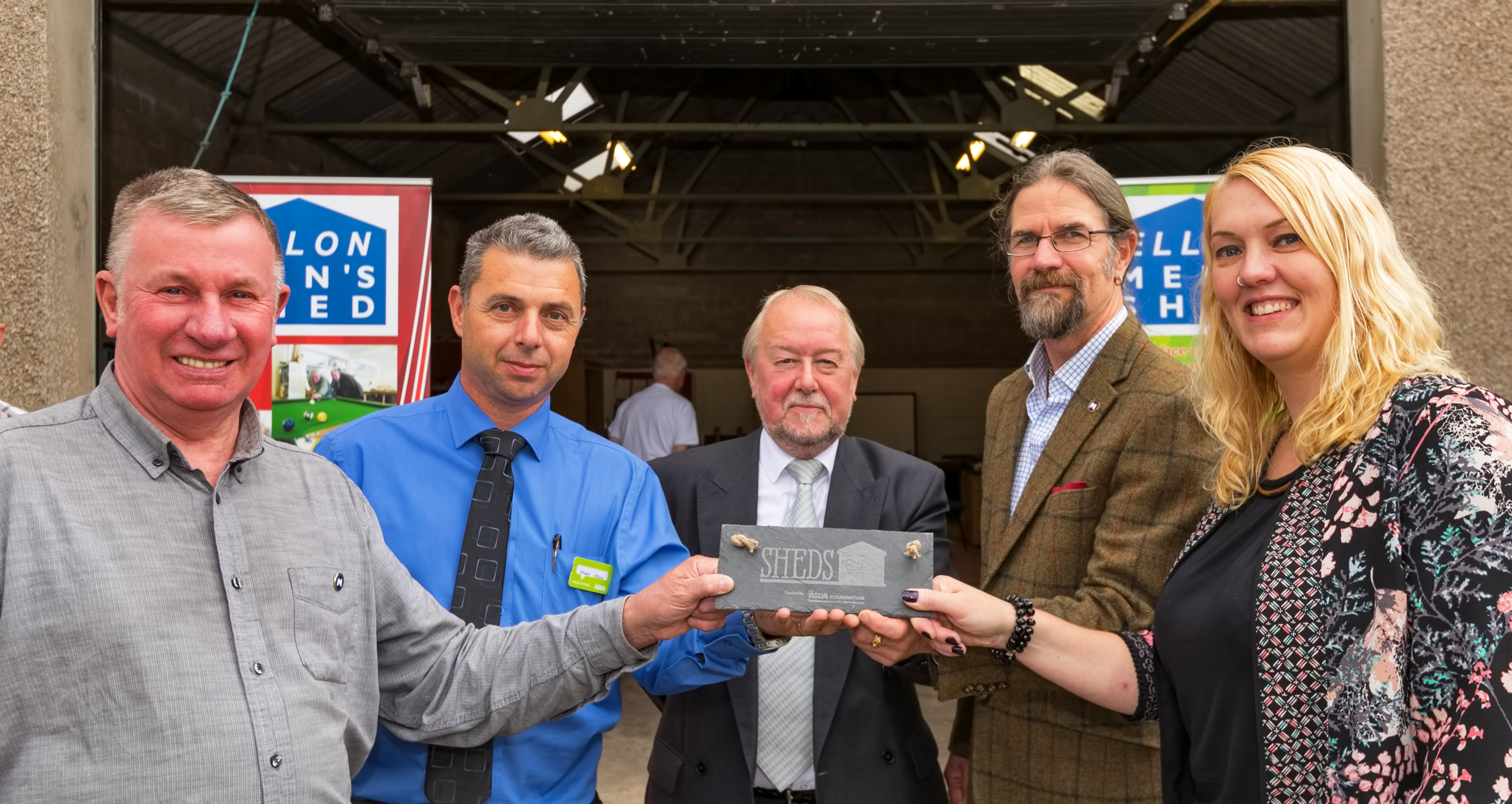Colin Grieve of Ellon Mens Shed with Stuart Wright, Asda, Councilor Rob Merson Ellon District,Jason Schroeder, Chaiman of the Scottish Mens Sheds and Jo Phillips of the RVS