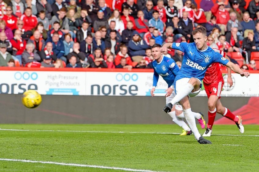 Rangers' Andy Halliday slots away the penalty kick