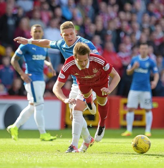 Rangers' Martyn Waghorn challenges Aberdeen's Peter Pawlett