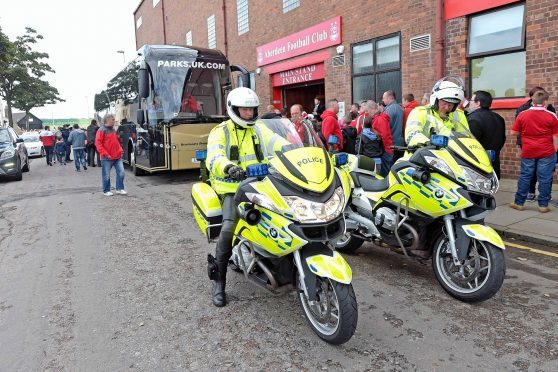The Rangers team bus arrives at Pittodrie in 2016 with a police escort