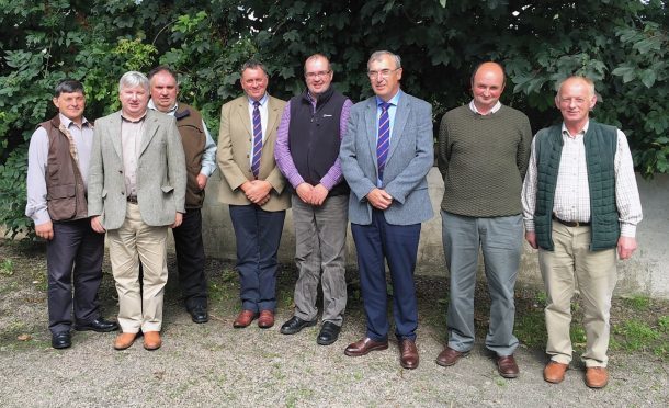 Arnott Coghill, Rodney Brass, Billy Campbell, Pete Watson (ANM Group's vice chairman), Stephen Sutherland, Pat Machray (ANM Group's chairman), Ian Gunn, and Donald Hymers. Andrew Mackay is not in the photograph.