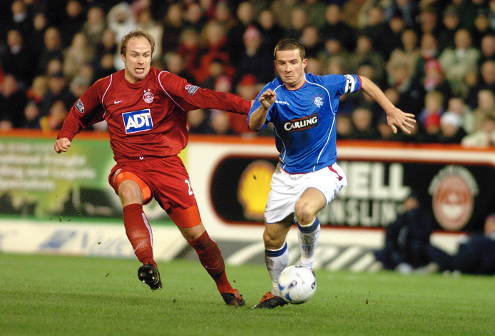 Neil MacFarlane and Rangers player Barry Ferguson battle it out in midfield at Pittodrie, 2006.