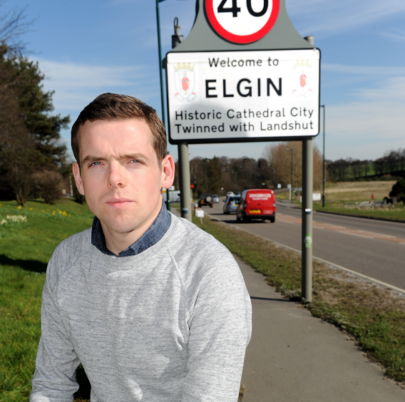 Highlands and Islands MSP Douglas Ross next to the A96 in Elgin.