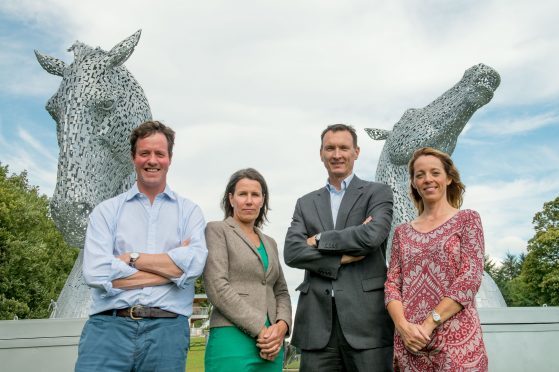 Dragons Angus MacDonald, Anja Baak, Steve Ham and Emma Parton with the miniature Kelpies statues at Neptune's Staircase, Banavie, Fort William.