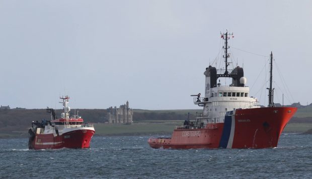 ETV Herakles towing the stricken vessel into Hatston