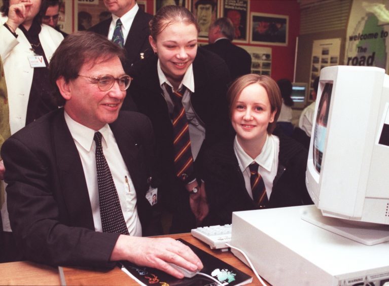 Education minister Brian Wilson is helped through a computer program by Ellon Academy 6th year pupils Cathy McAndrew(centre) and Julie Callaghan in 1990
