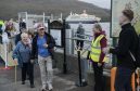 Boudicca passengers disembark to a warm welcome  from Sarah Kennedy of the Fort William Marina and Shoreline Company and other volunteers