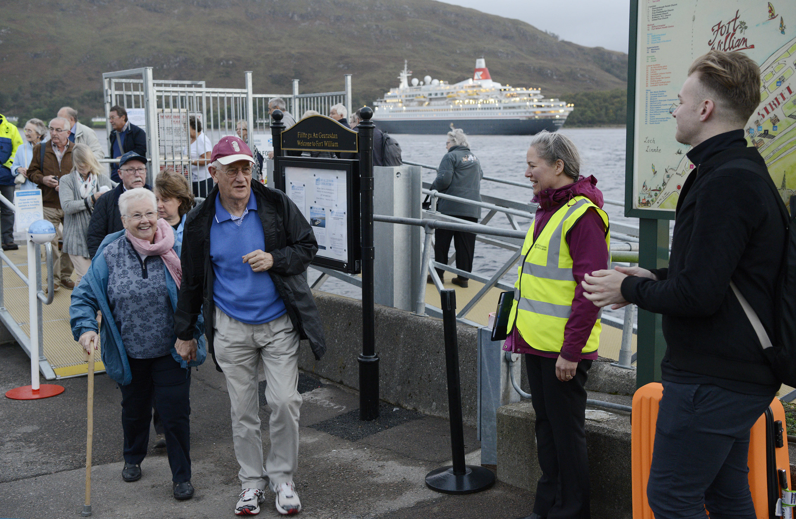 Boudicca passengers disembark to a warm welcome  from Sarah Kennedy of the Fort William Marina and Shoreline Company and other volunteers