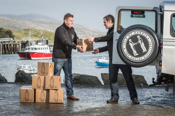 Harris Gin being loaded for delivery after fresh supplies of bottles arrived.