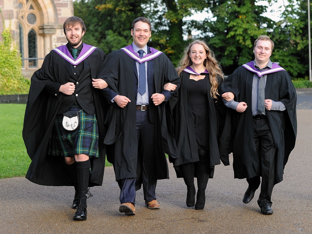 Inverness College UHI Graduations in Eden Court.  Friends united, Mark Paulin of Inverness, Michael Van't Zand of Kiltarlity, Holly Fraser of Inverness  and Adam Wylie of South Ronaldsay,