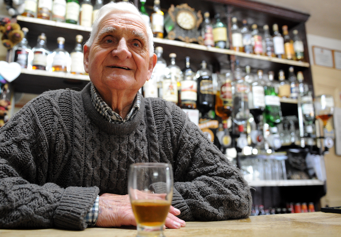 Joe Brandie behind the bar in the Fittichside Inn, Craigellachie, where he has worked for fifty-seven years with only four days off. Picture by Gordon Lennox.