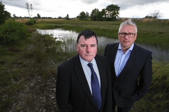 Councillor Ken Gowans and local resident George Moodie at an area of green belt land near Milton of Leys, which housing developer Tulloch Homes wants to build on.