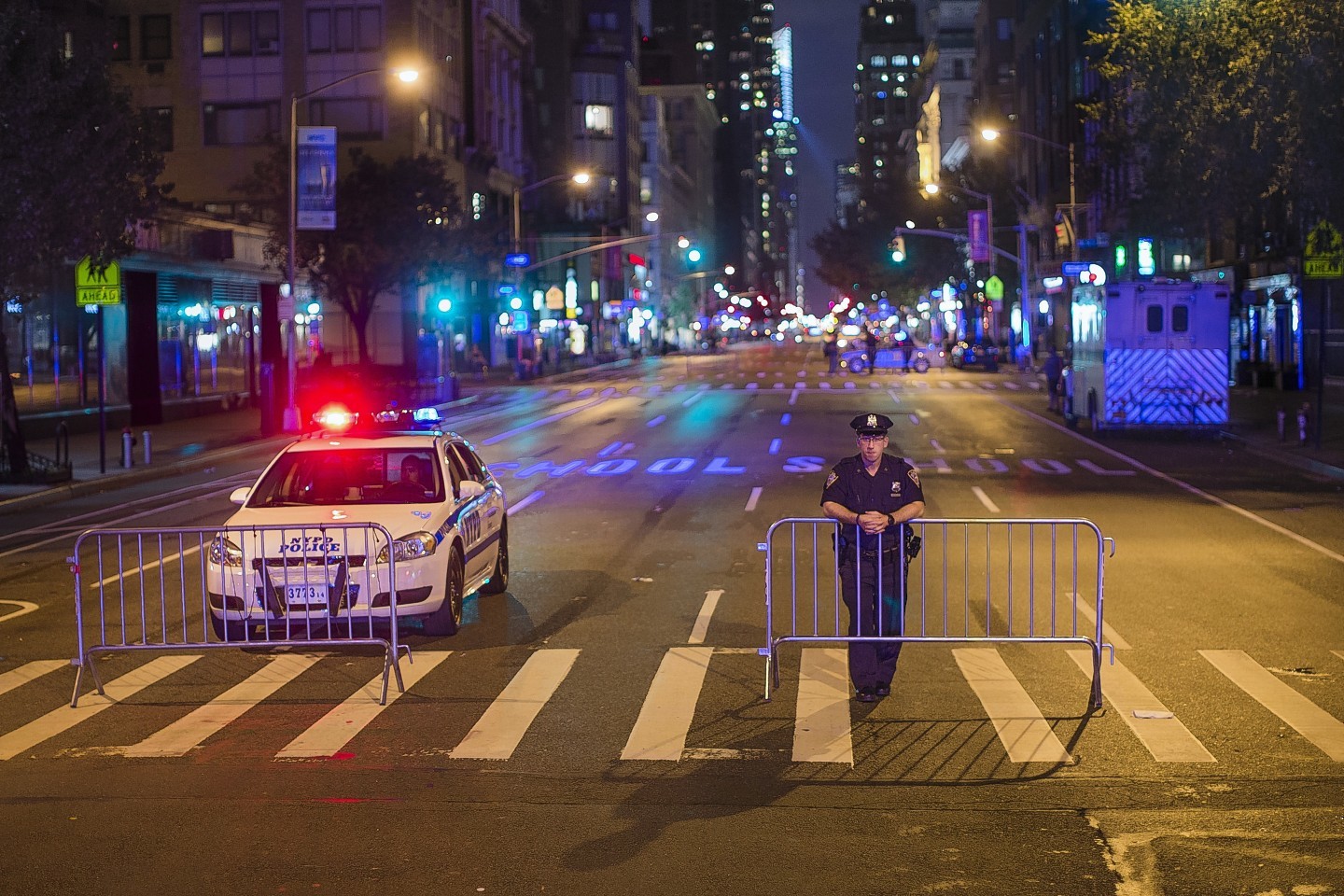 Police stand guard as the cordon Sixth Avenue near the scene of Saturday's explosion on West 23rd Street and Sixth Avenue