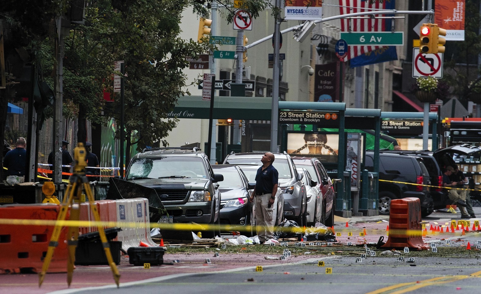 Crime scene investigators work at the scene of Saturday's explosion