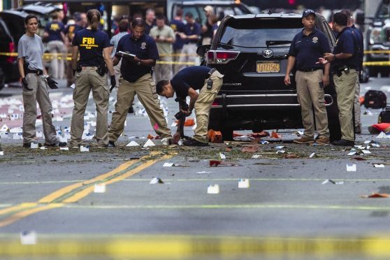 FBI carry on investigations at the scene of Saturday's explosion
